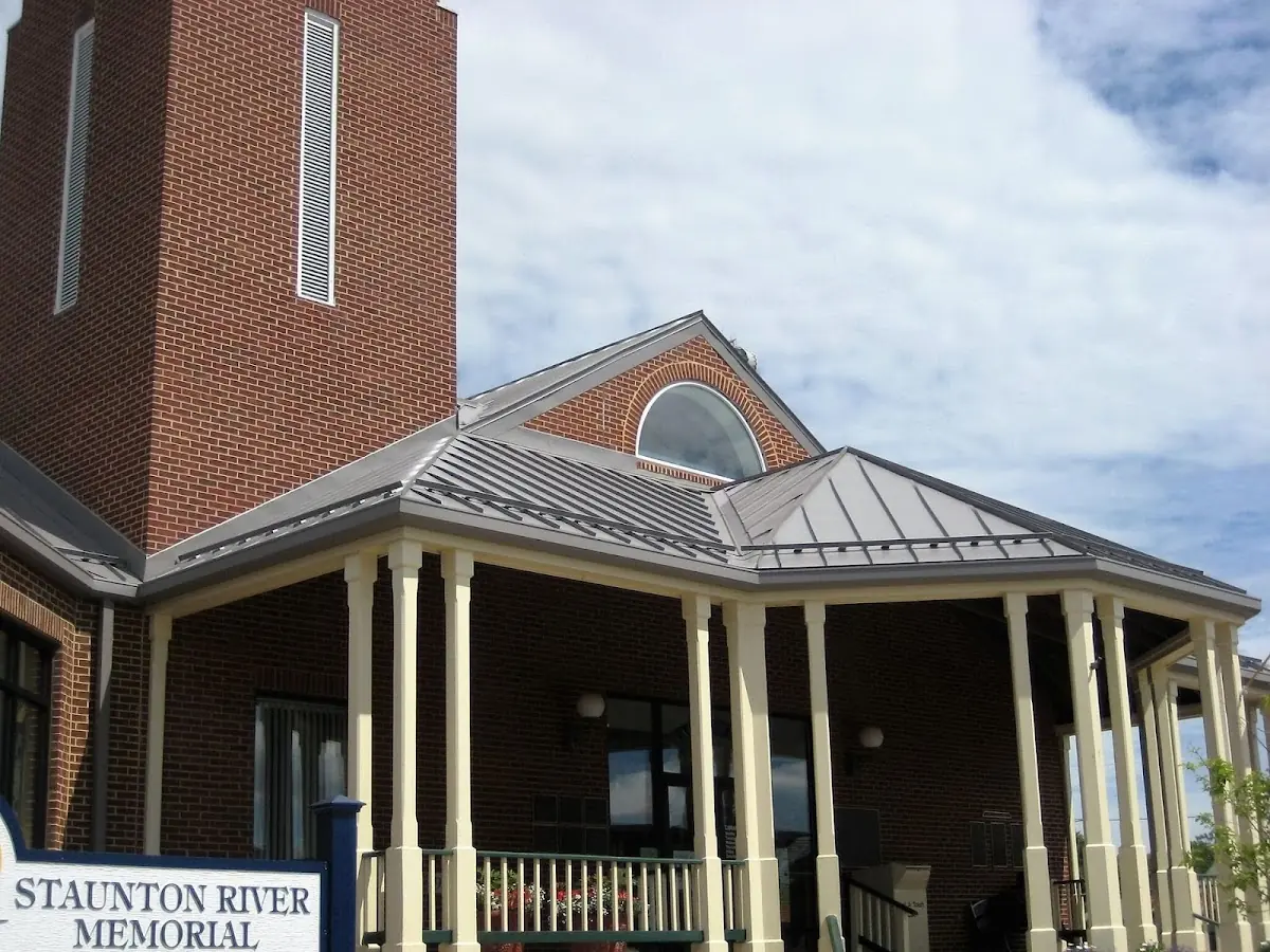Skilled roofing craftsmen working on a residential roof in Divinity Hill